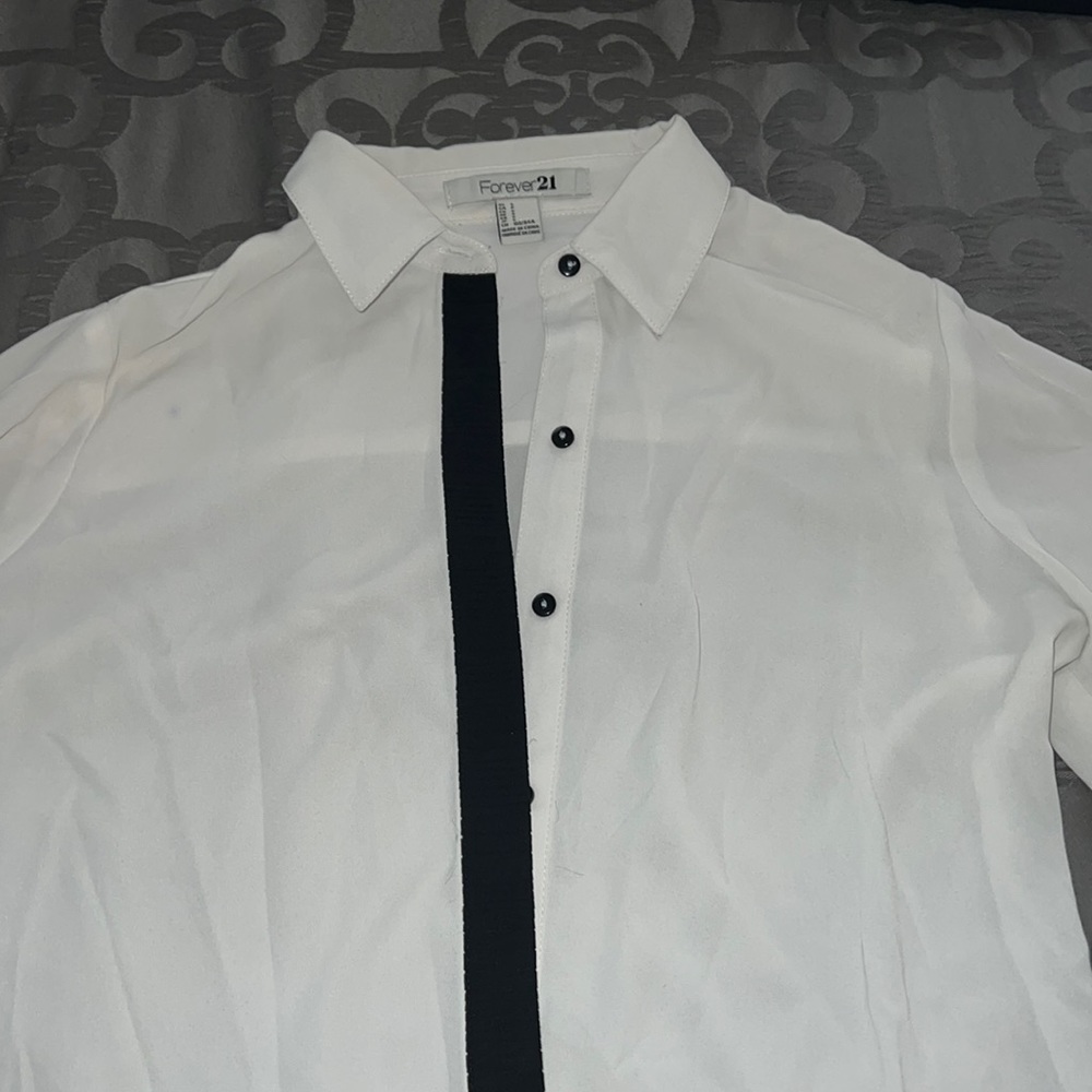 Nice white shirt. Black accents help dress it up a little